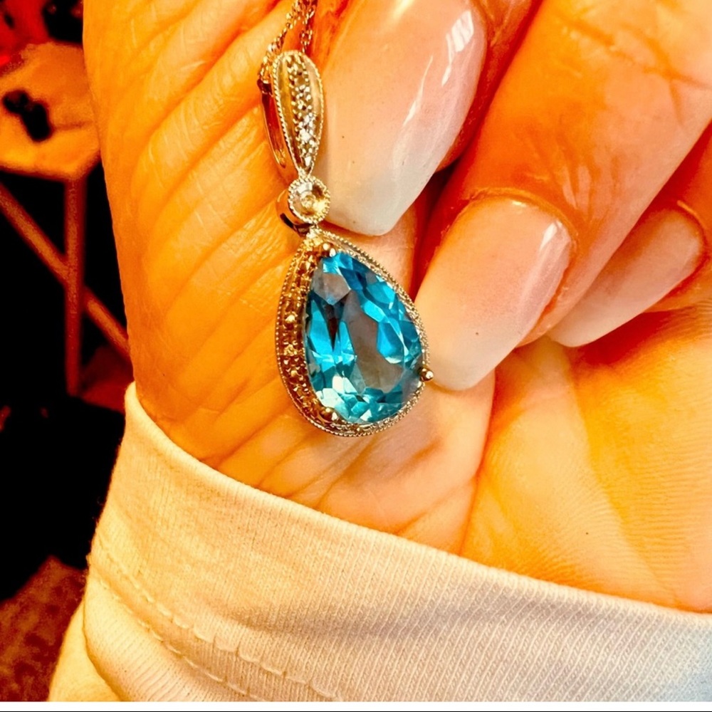 Beautiful 14 K blue topaz charm and necklace